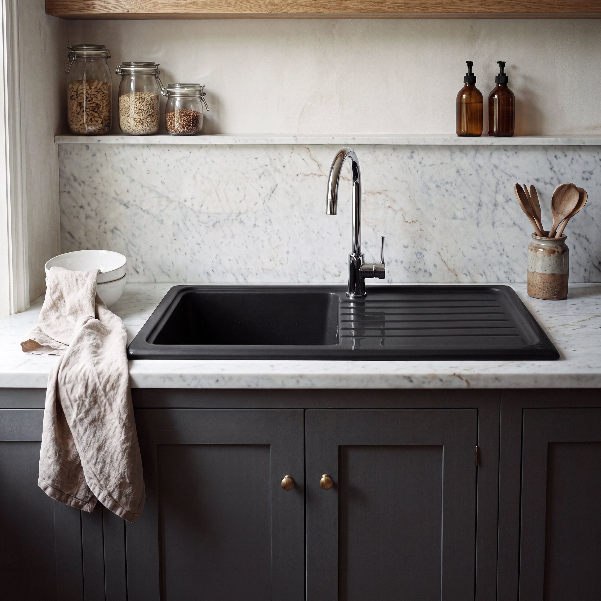 Nuie CT41T1010 Soft Black fireclay drainer sink installed in worktop, front view