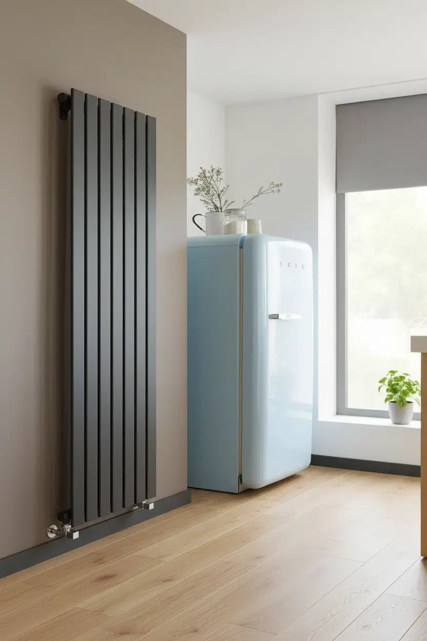 Kartell Boston anthracite vertical slatted designer radiator in a contemporary kitchen with warm grey wall and oak flooring