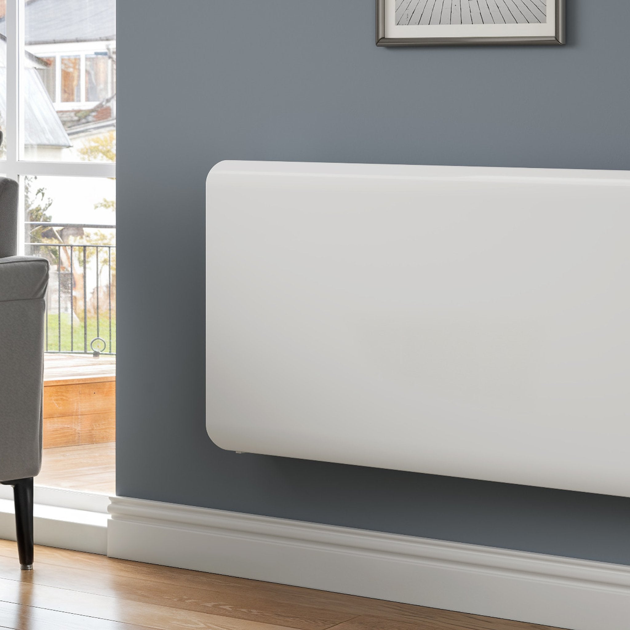 Reina Odet electric radiator in White, room setting close-up