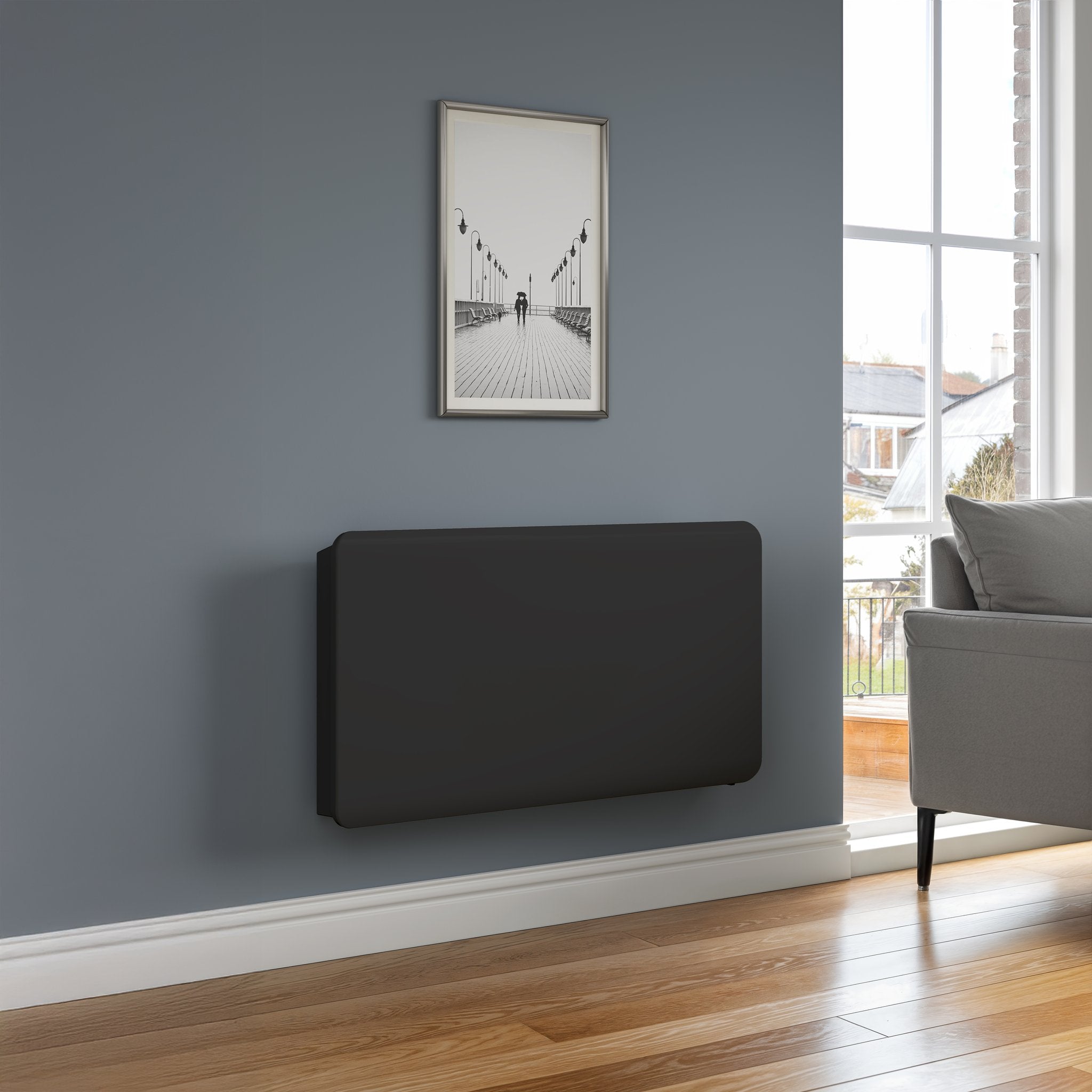 Reina Odet electric radiator in Anthracite, living room setting