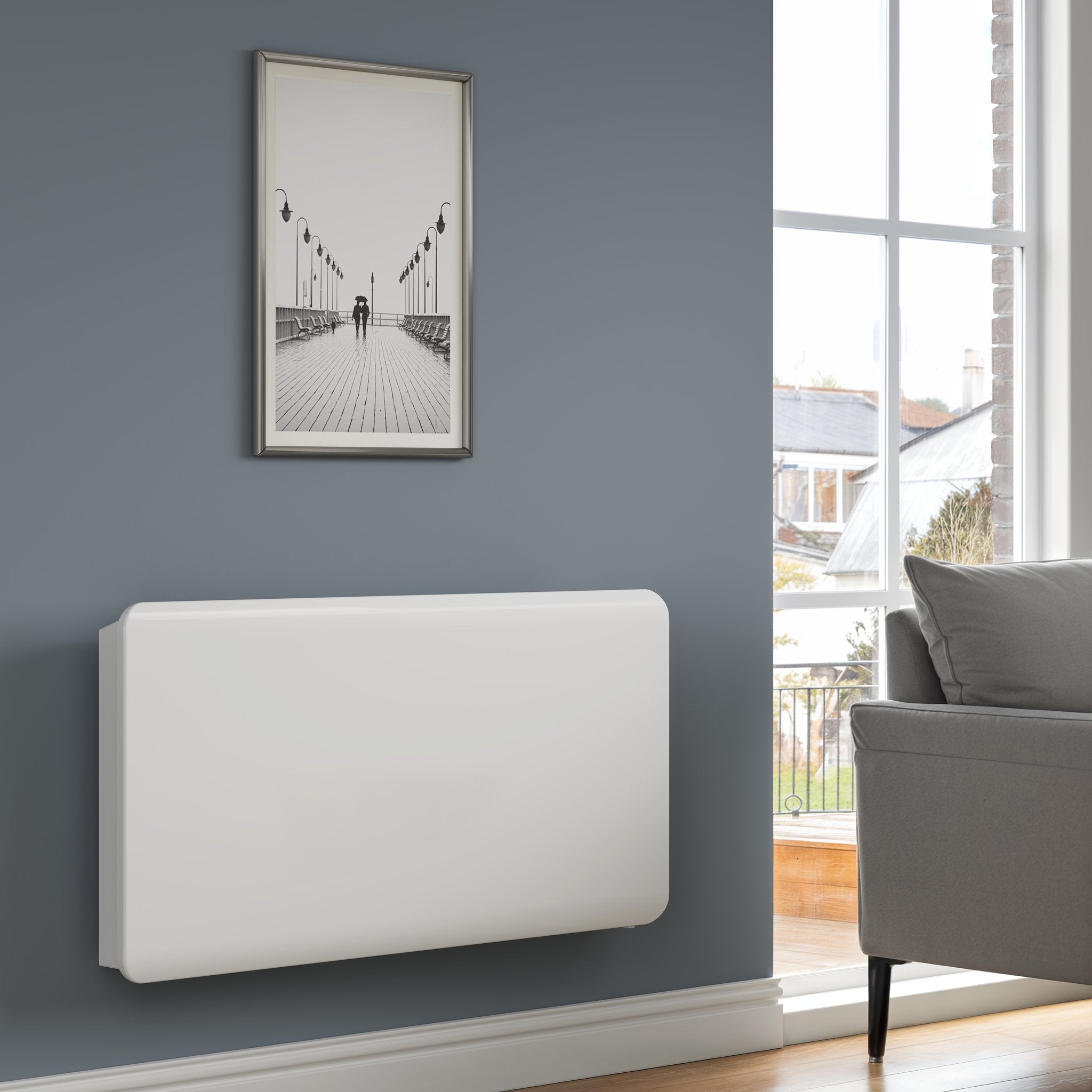 Reina Odet electric radiator in White, living room setting